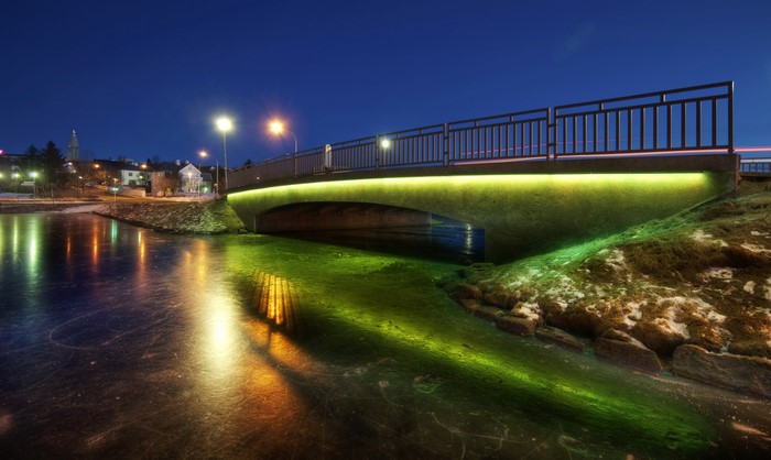 Bridge over frozen water at night in Reykjavik, Iceland