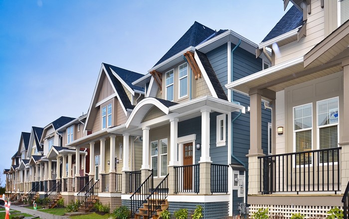 Row of modern houses with porches and windows