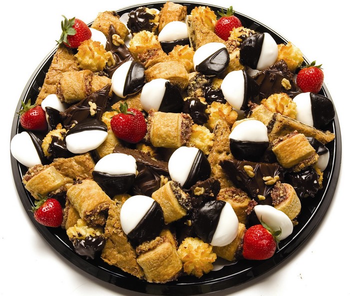 Assortment of cookies and strawberries on a platter