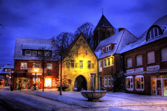 Havixbeck, Germany street in winter with snow and lights