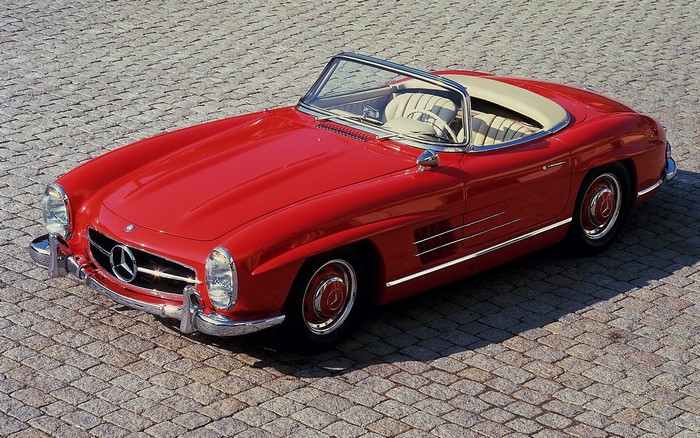 Red Mercedes-Benz 300 SL Roadster on Cobblestone