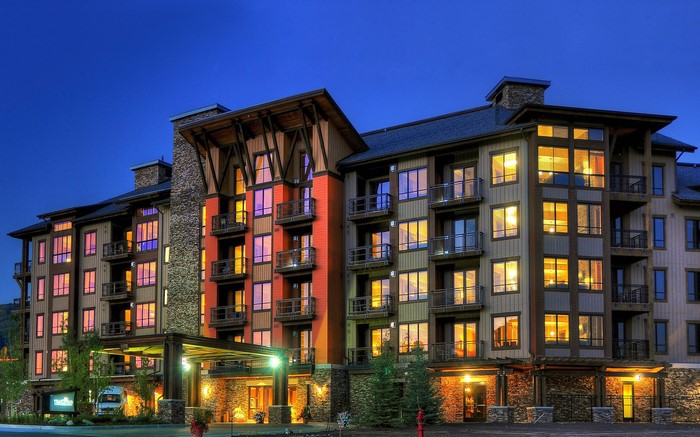Luxury hotel building at night with illuminated windows