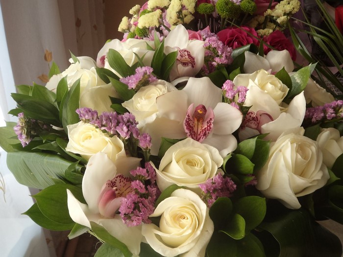White roses and orchids bouquet