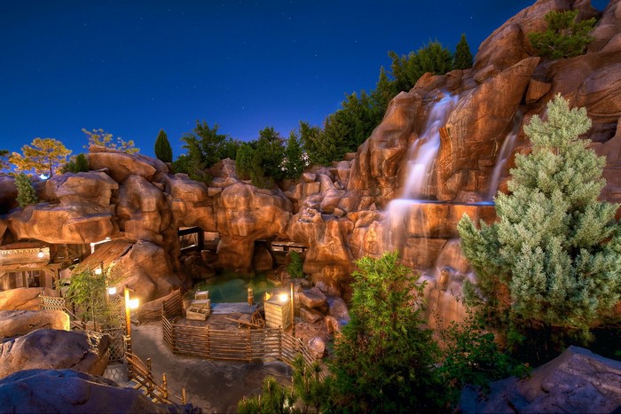 Waterfall and rocks at night in a theme park
