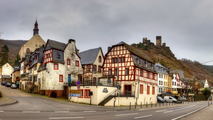 German village with church and castle ruins