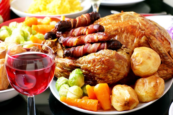 Roast Turkey Dinner with Pigs in Blankets and Wine