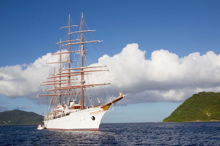 Tall Ship Sailing on the Sea with Islands