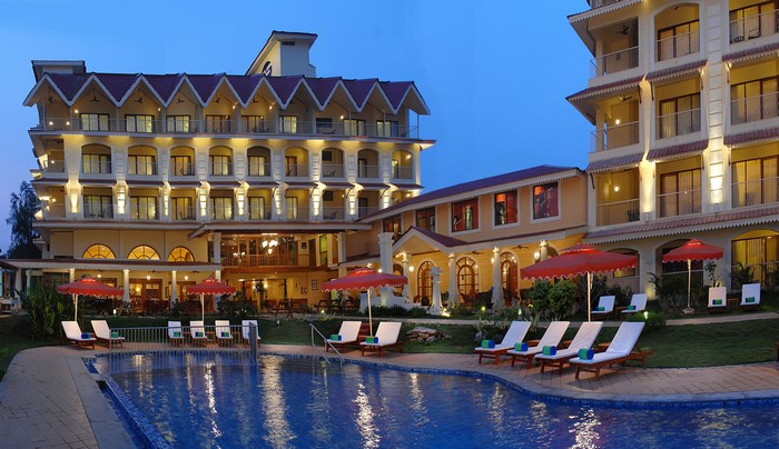 Resort hotel with swimming pool and sunloungers