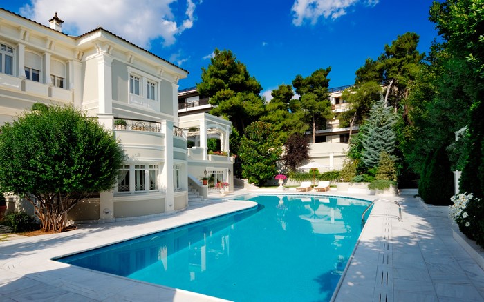 Luxury mansion with a swimming pool and trees