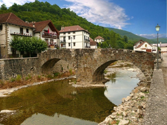 Stone bridge over a river in a Spanish village