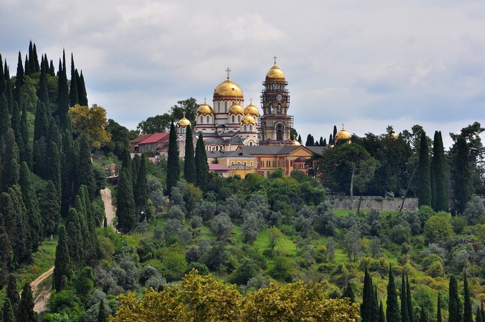New Athos Monastery with golden domes and cypress trees