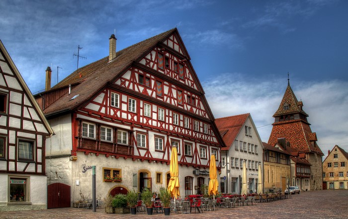 Half-timbered houses and tower in a German town square