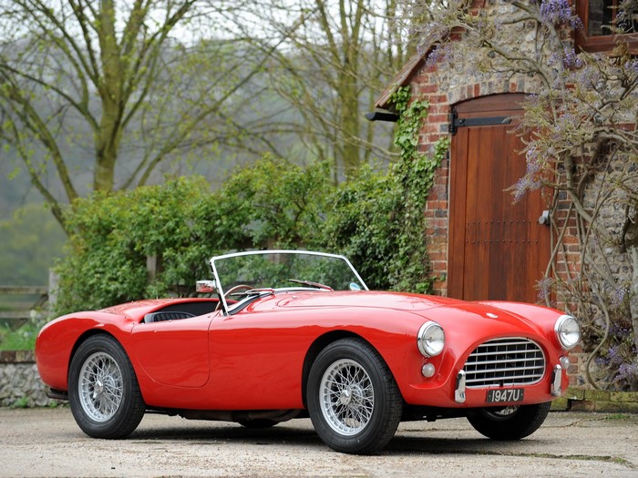 Red AC Cobra convertible sports car