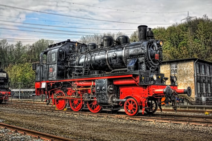 Vintage steam locomotive on railroad tracks
