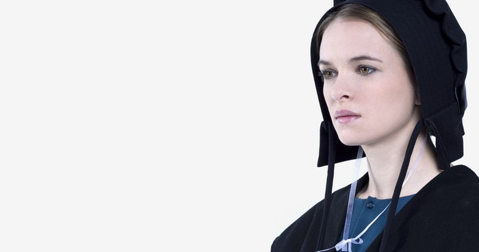 Woman wearing a black bonnet