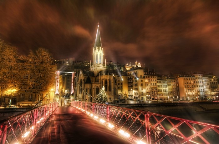 Night view of Lyon with a bridge and church