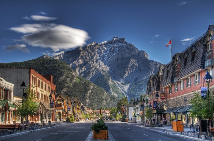 Street view of Banff with mountains and buildings