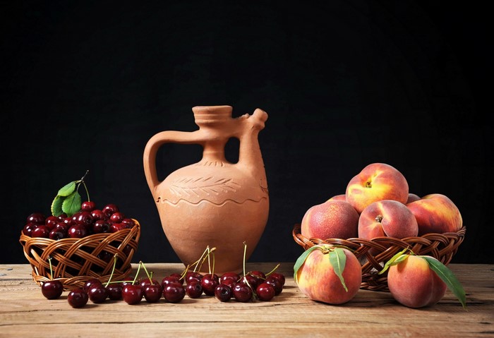Still-life with cherries, peaches, and a jug