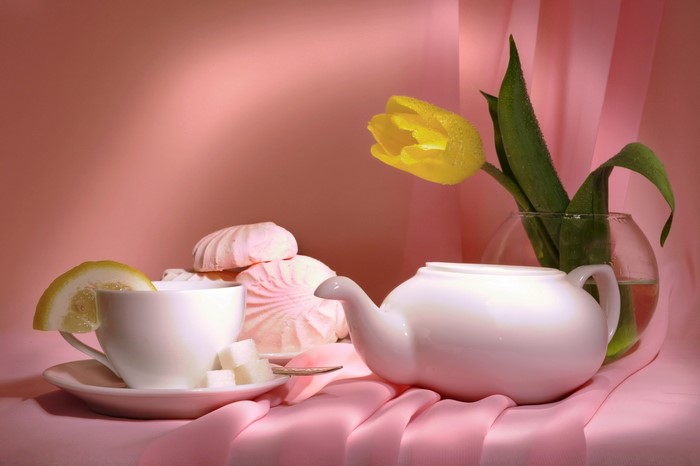 Still life with tea cup, marshmallows, and tulip