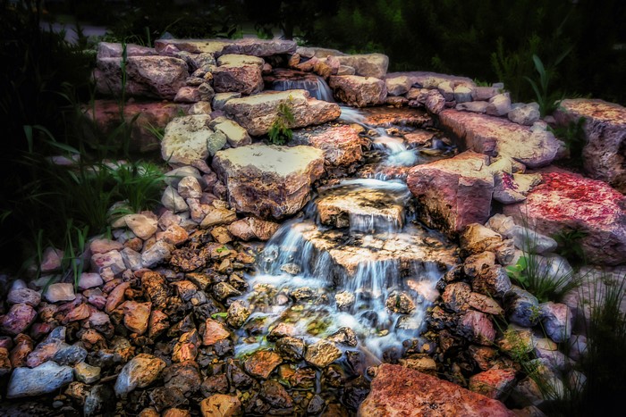Waterfalls cascading over rocks with HDR effect