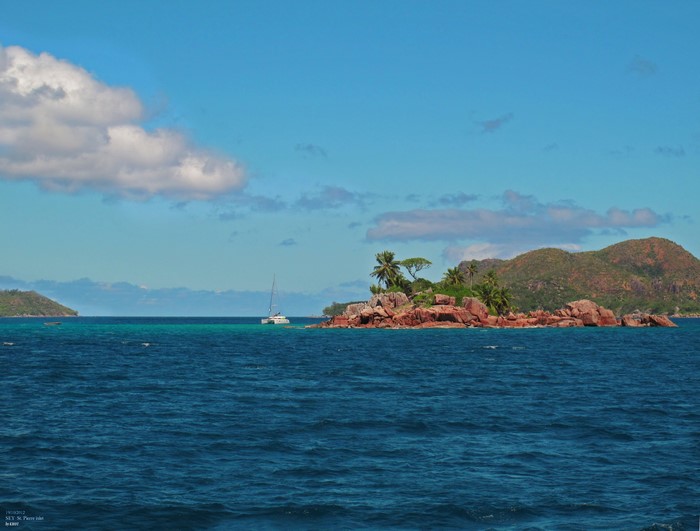 Catamaran sailing near tropical islands in the Seychelles