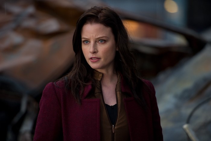 Brunette woman in maroon coat