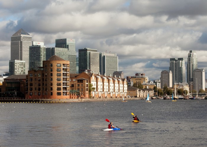 Kayakers on River Thames with London Skyline