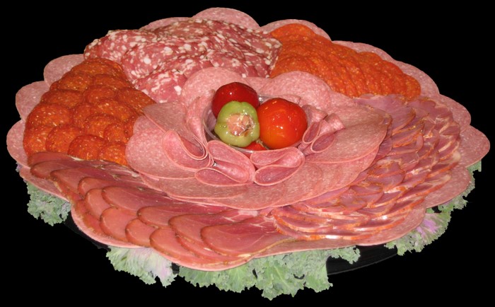 Flower-shaped charcuterie board with various meats and tomatoes