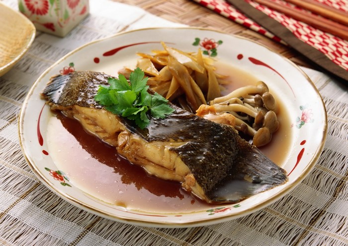 Braised Fish with Mushrooms and Root Vegetables on a Plate