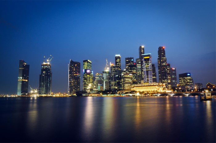 Singapore skyscrapers at night over water