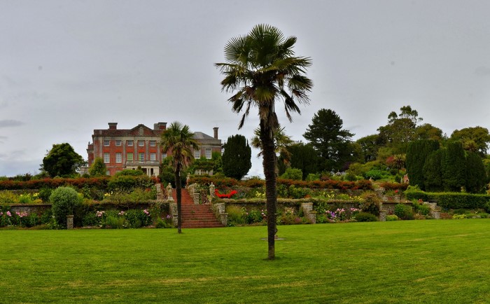 Manor house and gardens with palm trees