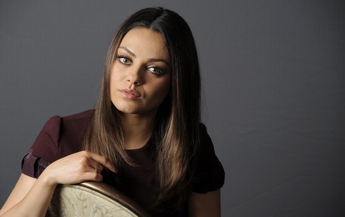 Mila Kunis looking to the side