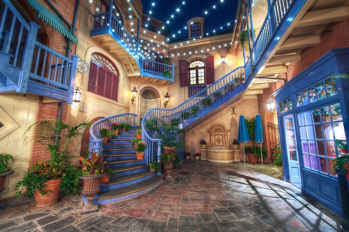 Courtyard with blue stairs and fairy lights