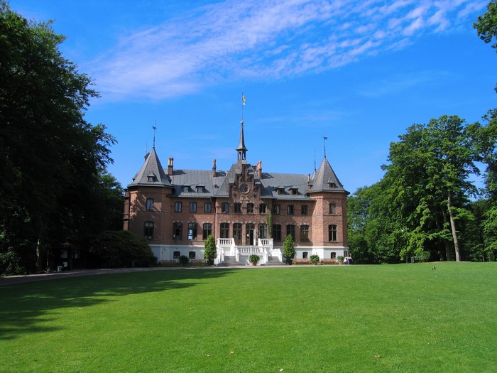 Sofiero Castle in Sweden with a large green lawn