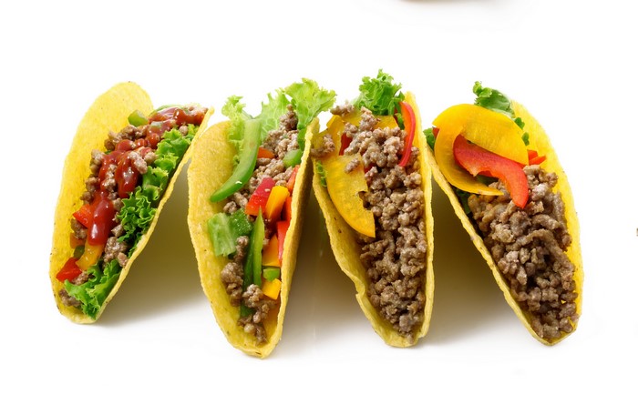 Four tacos with ground beef and vegetables