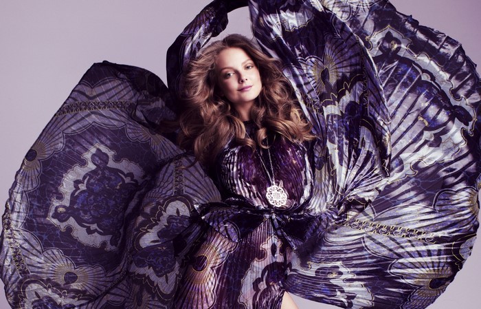 Eniko Mihalik in a flowing purple patterned dress