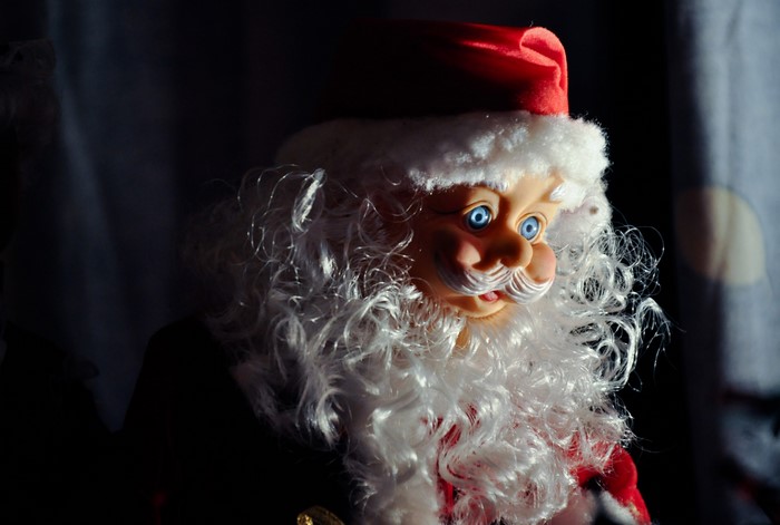 Close-up of a Santa Claus doll with blue eyes