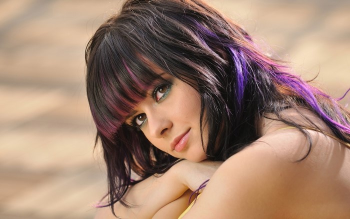 Brunette girl with purple streaks in hair