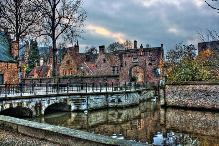Canal bridge and brick buildings in Bruges, Belgium