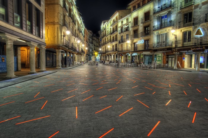 Plaza with illuminated pavement in Teruel, Spain at night