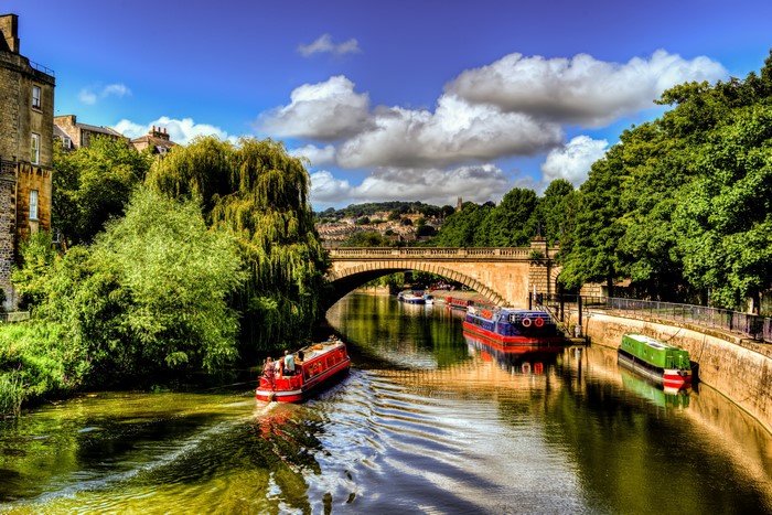 Boats on a River Under a Bridge in the UK