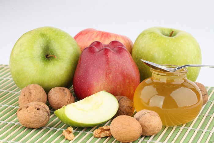 Apples, Nuts, and Honey on a Bamboo Mat