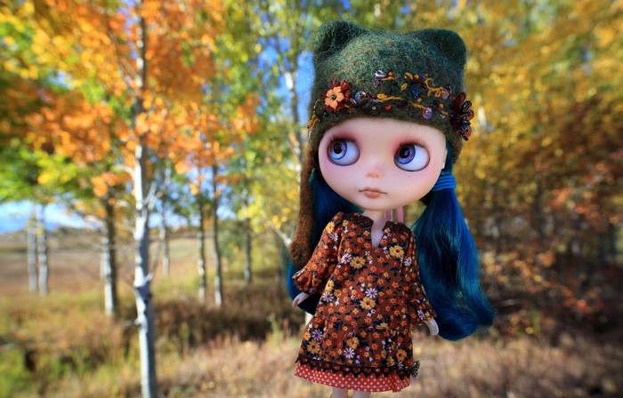 Whimsical Doll in Autumn Forest