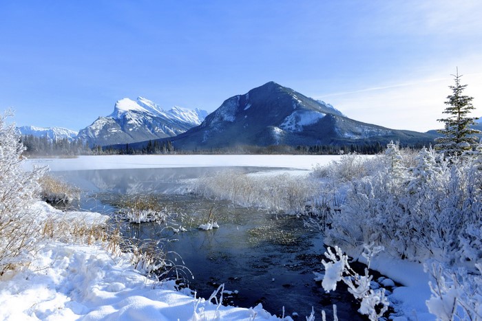 Snowy Mountains and Frozen Lake in Banff National Park, Canada