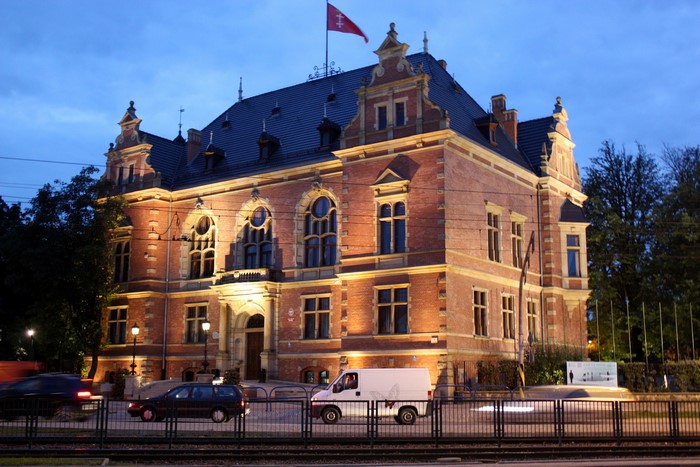 Brick building with flag at dusk in Poland