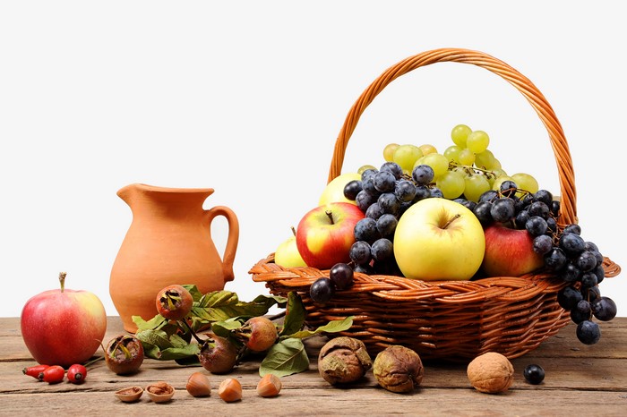 Still-life of fruit and nuts in a wicker basket