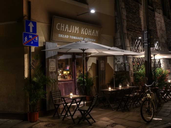 Chaim Kohan store and cafe in Krakow at night