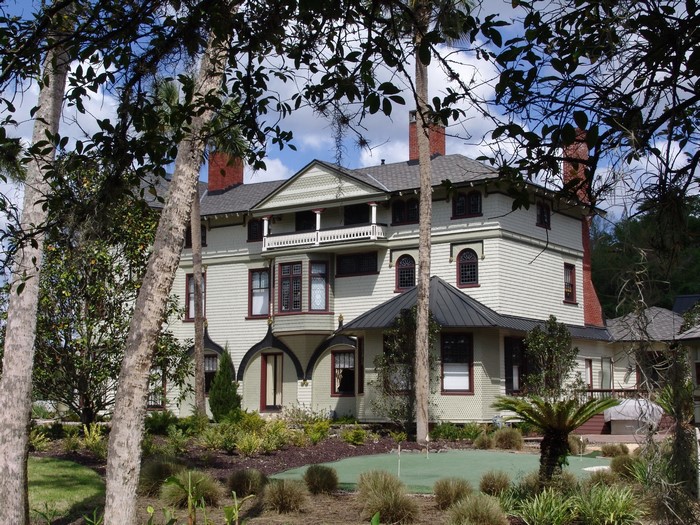 Victorian House in Florida with Trees and Mini Golf