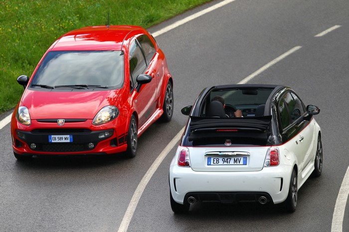 Red Abarth Punto Evo and white Fiat 500 convertible