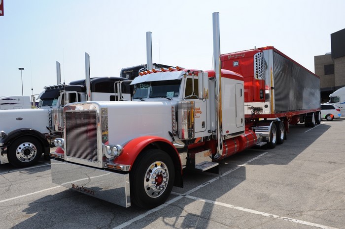 Peterbilt trucks with trailers parked in a lot